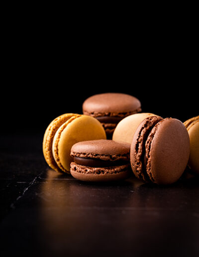 Bunch of macarons on a dark background