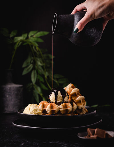 Waffles with ice cream and pouring chocolate